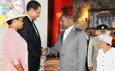 Former President Dr. Liverpool greets new President Charles Savarin and Mrs. Savarin