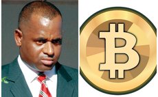 Prime Minister Skerrit and BitCoin logo