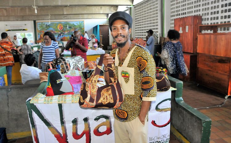 A proud Dominican displays his creations at an Expo