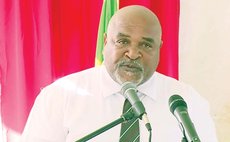 Hon Minister for Housing Reginald Austrie speaks at Grand Bay handover ceremony