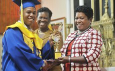 Richards receives award from Mrs. Savarin