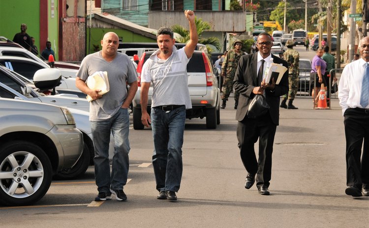 Sanford (second from left) and his lawyers leave police headquarters after the arrest