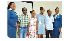 Scholarship Recpients and officials of DOMLEC pose at the ceremony