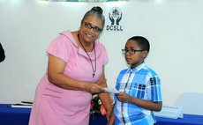 Sev Sage McKenzie receives scholarship award from DCSLL president Josephine Dublin