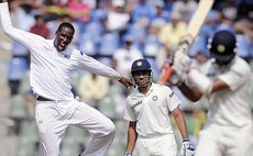 Shane Shillingford celebrates taking another Indian wicket