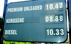 sign showing latest prices at the NP station in Canefield