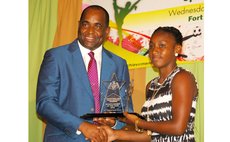 Prime Minister Skerrit presents award to Shanne Angol, Sportswoman of the Year