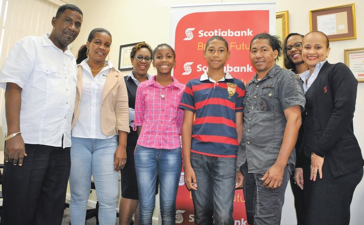 Students and their parents pose with Bank Staff