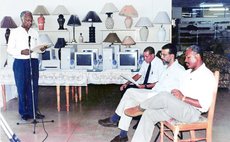 File photo: Southwell,left, as manging director of J. Astaphan