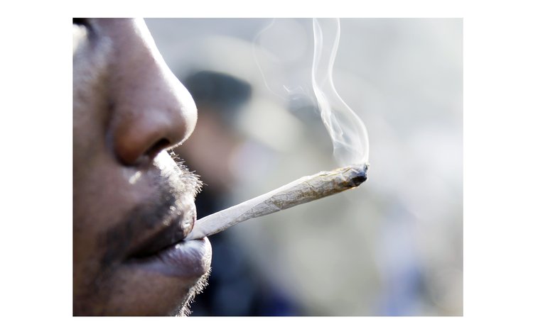 Man smoking a marijuana spliff