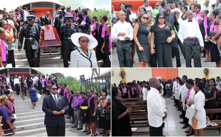 Relatives, friends and colleagues attend the funeral service of Dr. Phillip St. Jean
