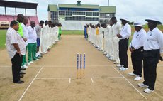 Teams and match officials observe a minute's silence in memory of Phillip Hughes