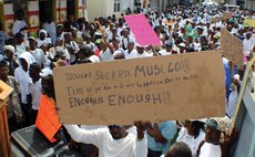 Protester holds up sign at the 7 February 2017 UWP protest