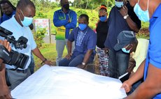 Officials of UWP examine a map of the Wesley area