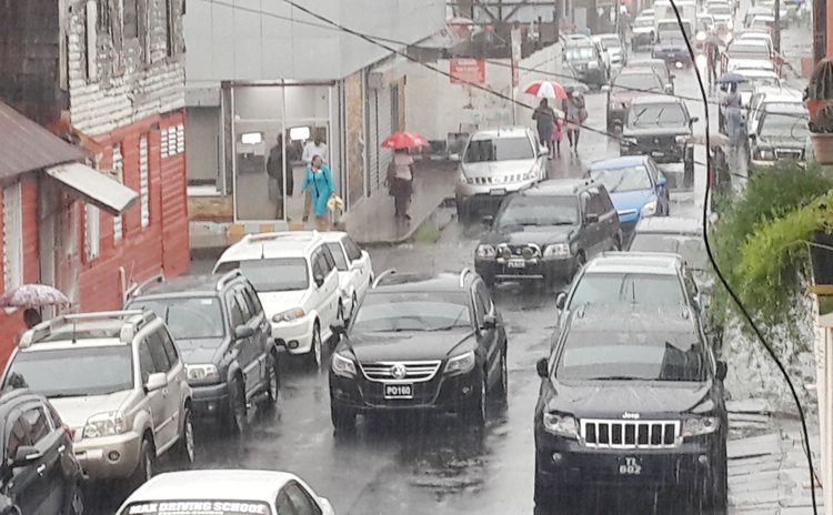 A wet and rainy Monday afternoon on Independence Street, Roseau