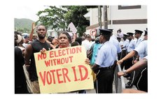 Woman holds a sign during electoral reform protest