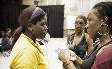 Mari-Jo (left) being interviewed by a journalist following the stating of the musical, while Michelle Cox looks on.