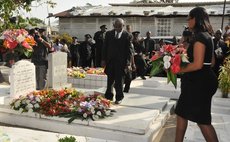 Francine Baron lays flowers at her father's grave