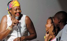 Ophelia performs with children at an earlier concert