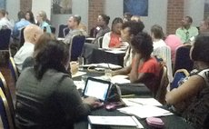 Peace Corps volunteers discuss at workshop