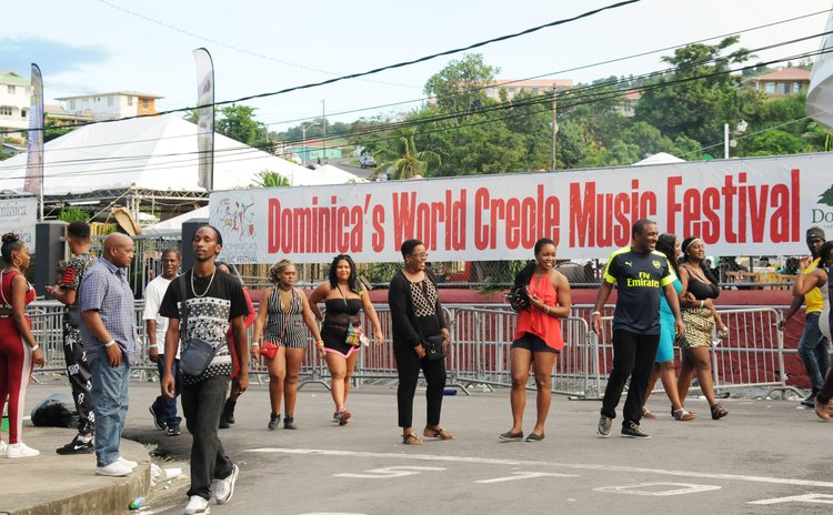 People leave the Windsor Park Sports Stadium, the site of the World Creole Music Festival